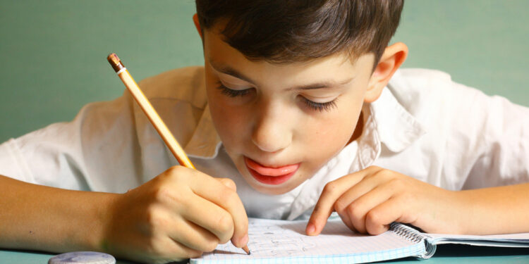 Why do I sometimes bite my tongue while concentrating on things?