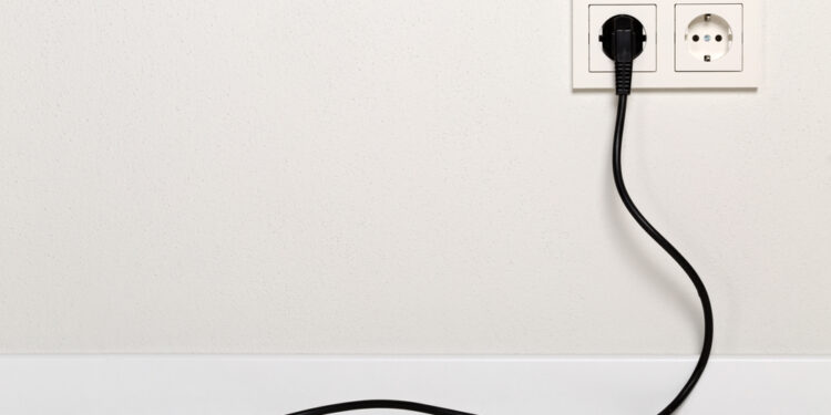 Why do some devices have plugs with two prongs, and others have three to work?